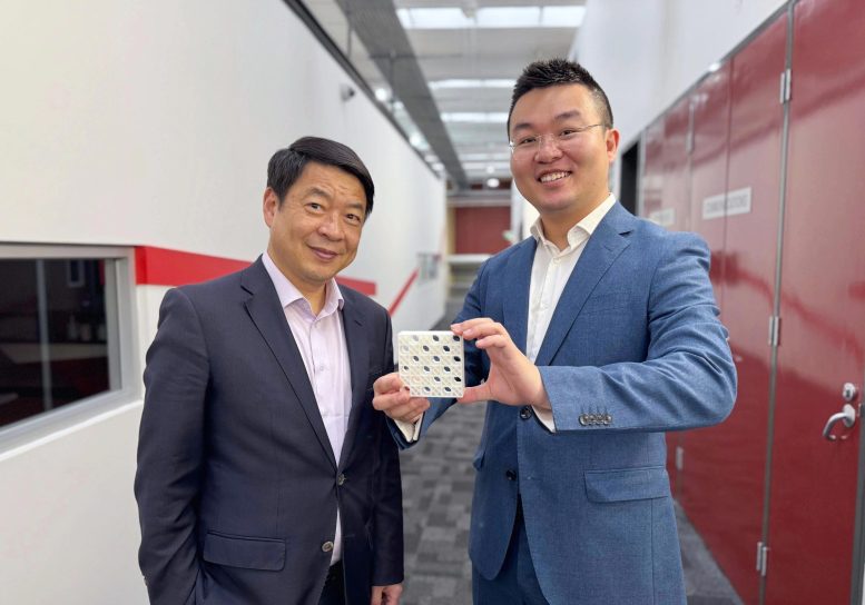 Honorary Professor Mike Xie and Dr Jiaming Ma Hold a 3D Printed Model