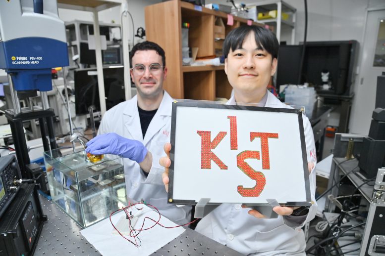 A Researcher Illuminates an LED With the KIST Logo via Wireless Power Transfer
