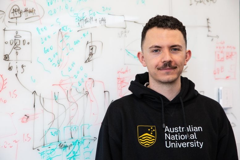 Joshua Jordaan Stands in Front of His Equations